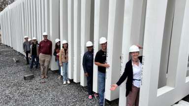 Image shows construction team with some of the panels that will be the shell of Raleigh's new City Hall