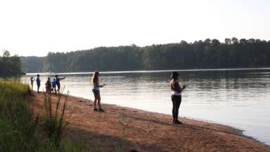 children fishing off the bank of Forest Ridge park