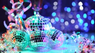 an image of disco balls under colorful lights