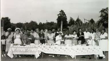 Historic photo of a picnic. Group of individuals in 1958