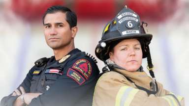 Two RPD and RFD officers standing back to back