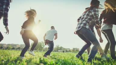 adults in a field doing activities