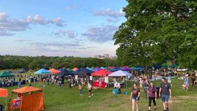 Tents in front of the Raleigh skyline at Raleigh's Earth Day celebration