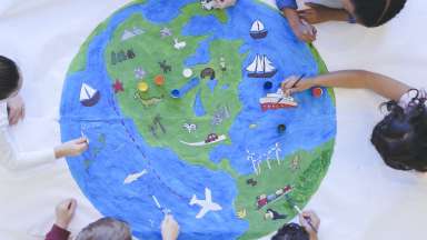map of the earth with kids coloring it