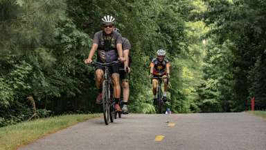 greenway trail riders with helmets on