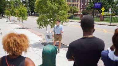 group tour walking through downtown Raleigh