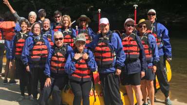 people in front of a raft