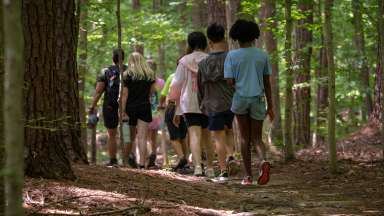 a group hiking on the trails of Wilkerson nature preserve