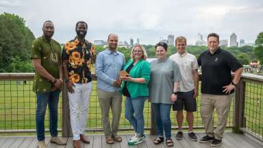 Environmental award winners accept a trophy.