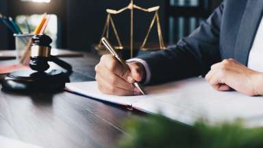 Lawyer signing papers
