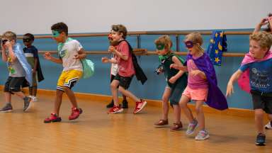 young superhero campers having a blast