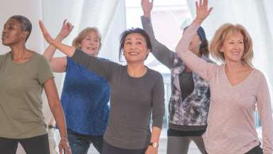 a group of people smiling and dancing