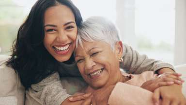 an image of an adult mother and child hugging