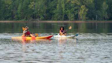 people on kayaks