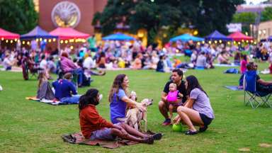 People enjoying a night in Moore Square