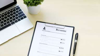 Paper resume placed on work desk
