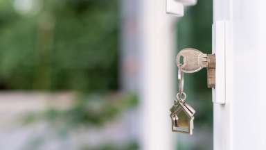 Key opening door to home