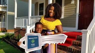 Mother and Son Holding Key