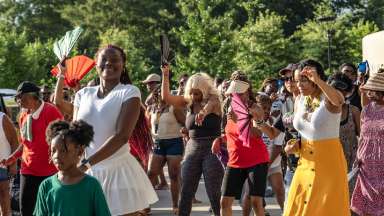 people dancing in the street