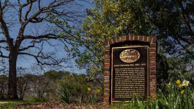 a park with a stone memorial