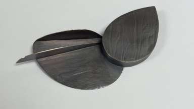 Metal hand-made Brooch that resembles leaves