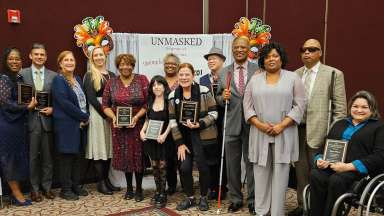 Group photo of 2024 MCPD Banquet awardees and community members standing together and smiling.