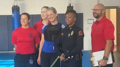 Mayor Cowell stand with RPD fitness test team after completing the training academy test.