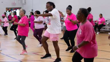 people dancing for breast cancer