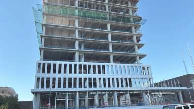 City Hall construction site from the parking deck on Morgan Street, this image shows the new glass going into the windows and the precast shell going up