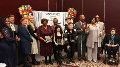 Group photo of 2024 MCPD Banquet awardees and community members standing together and smiling.