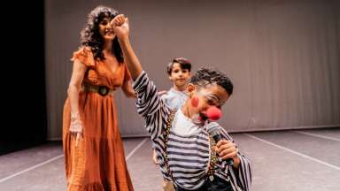 a kid in a costume for theatre
