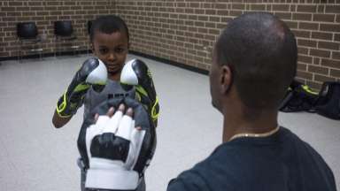 a boy practicing boxing