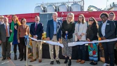 Mayor cuts ribbon with other officials at bioenergy recovery project