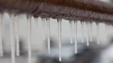 Frozen pipe with icicles hanging off