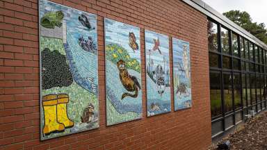 An image of the four mosaic panels attached to the community center