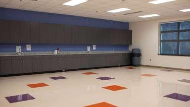 Large countertop workspace with two hand washing sinks and open space