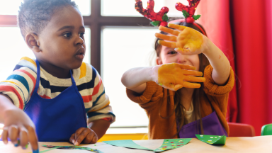 Preschool kids doing homemade decorations for the holidays