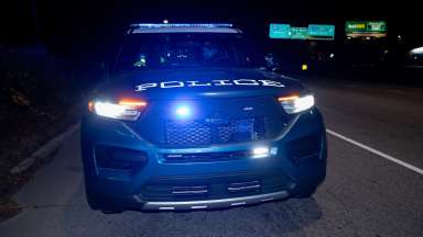RPD Car at night with sirens flashing