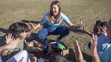 Counselor playing with kids