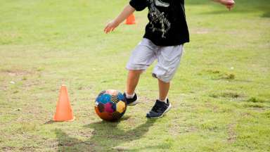 a kid playing soccer