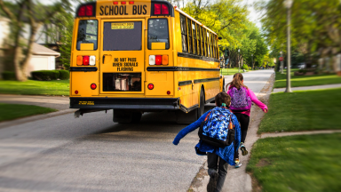 Children catching school bus