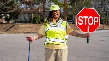 School crossing guard holding stop sign