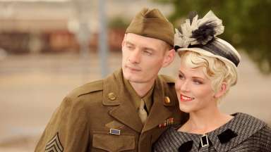 two people in vintage 1940s-style clothing