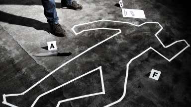 a crime scene with tape on the floor