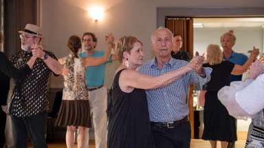 people dancing at a community center