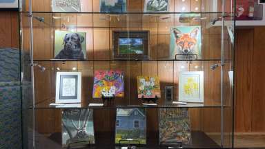 paintings in a variety of mediums on display