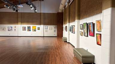 paintings in a variety of mediums on display