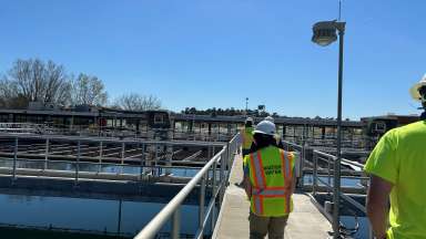 worker walking down water plant