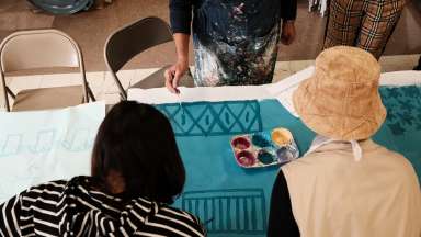 people doing a paper mural