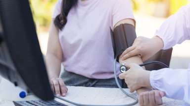 a person getting their blood pressure check